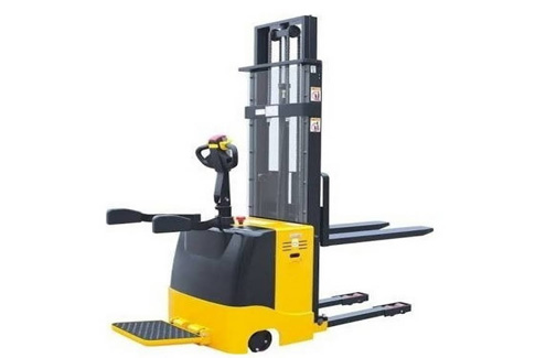 Electric walkie stacker operating in narrow warehouse aisles